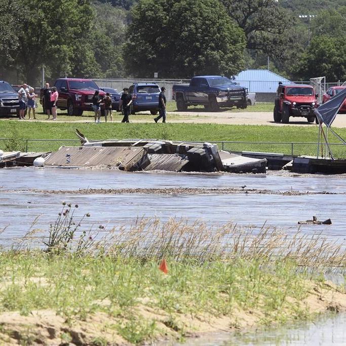 Midwestern flooding collapses a bridge, forces evacuations and kills at least 2